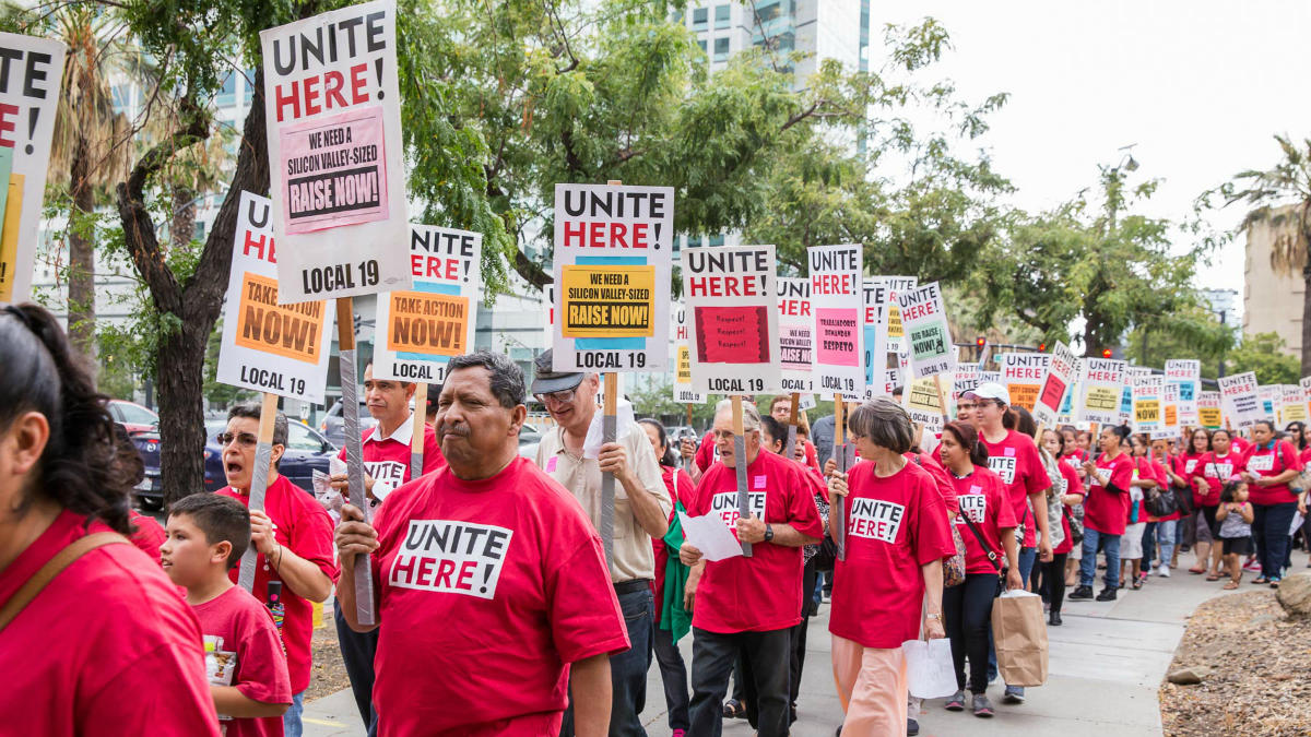 Members of Unite Here Local 19 demonstrate for a raise